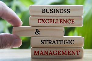 Business excellence and strategic management text on wooden blocks. Business culture and success factor concept photo