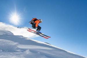 Skier at speed flying through the sky photo