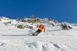 Mountaineering skier downhill photo