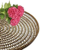 Woven rattan table runner, plate, glass isolated on white background with clipping path photo