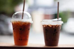 Black coffee with orange juice and iced mocha on wooden table photo