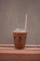Iced mocha on wooden table photo