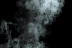 Abstract  powder or smoke isolated on black background photo