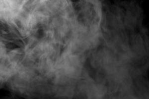 Abstract  powder or smoke isolated on black background photo