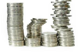 Saving money concept of business concept with coin stacks isolated on white background photo