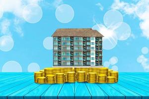 Start creating family with top table condominium and coin on white cloud and blue sky background,Dream family concepts photo