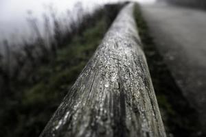 Wet wooden railing photo