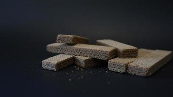 chocolate wafer on black background. photo