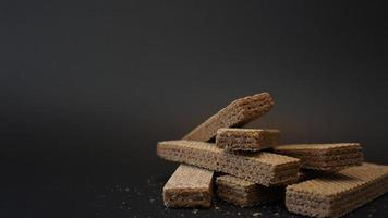 chocolate wafer on black background. photo