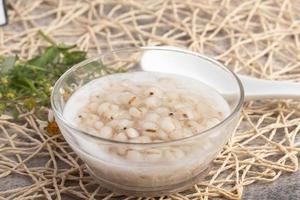 Job's tear in coconut milk in a glass cup photo