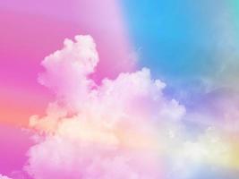 colorful with fluffy clouds on sky. multi color rainbow image. abstract fantasy growing light photo