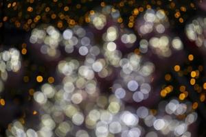 abstract love light orange and white color in night black background. bokeh in circle shape photo