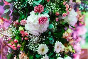 archway of many beautiful flowers, wedding arch with peonies Flowers for a wedding arch photo