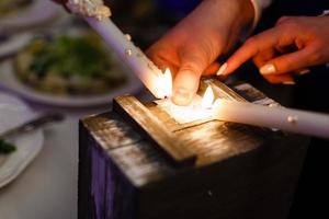 Two advent lights burning Two burning candles Wooden box photo