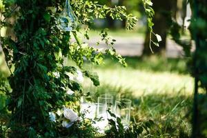 Wedding decorations. country style. Solemn ceremony. Wedding in nature. Candles in decorated jars. Just married. Wedding decor. photo