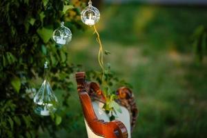 Original wedding floral decoration in the form of mini-vases and bouquets of flowers hanging from the ceiling photo