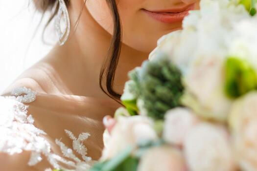 stylish wedding bride smiling, holding bouquet. modern bride hugging groom, lips and earrings close up. fine art wedding photo, romantic moment, long edge photo