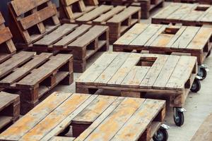 Empty wooden pallet in loft interior with grunge walls. Decor of wooden pallets photo