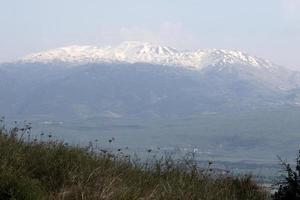 Snow lies on the top of Mount Hermon photo