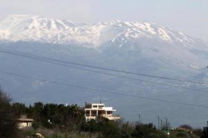 Snow lies on the top of Mount Hermon photo