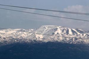 Snow lies on the top of Mount Hermon photo