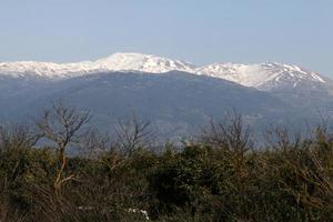 Snow lies on the top of Mount Hermon photo