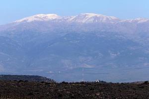 Snow lies on the top of Mount Hermon photo