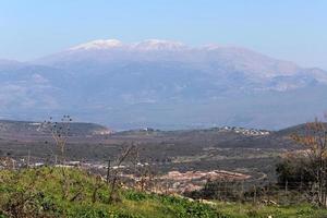 Snow lies on the top of Mount Hermon photo