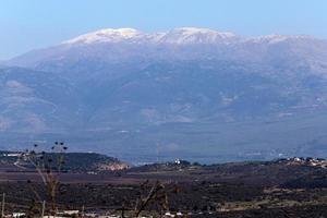 Snow lies on the top of Mount Hermon photo