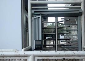 Jakarta, Indonesia - January 21th, 2023 - Old unoperated aged and rusty turnstile gate way in Gelora Bung Karno Stadion with security access control device. photo