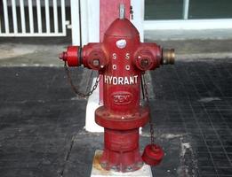 Jakarta, Indonesia - January 21th, 2023 - Red metal fire hydrant pole in Gelora Bung Karno Stadion. photo