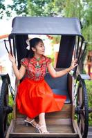 Smart girl in red  color dress style chiness new year in culture and public chiness temple background photo