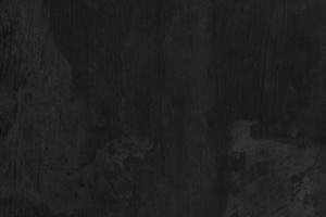 Black Cement scratch background. Texture placed over an object to create a grunge effect for your design. photo