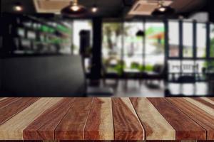 wood table top in coffee shop blank for design photo