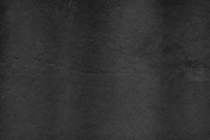 Black Cement scratch background. Texture placed over an object to create a grunge effect for your design. photo