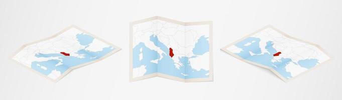 Folded map of Albania in three different versions. vector