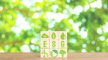 The esg and eco icon on wood cube for eco concept 3d rendering photo