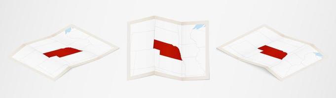 Folded map of Nebraska in three different versions. vector