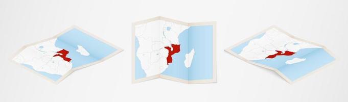 Folded map of Mozambique in three different versions. vector