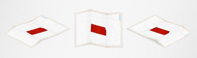 Folded map of Kansas in three different versions. vector