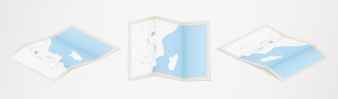 Folded map of Comoros in three different versions. vector