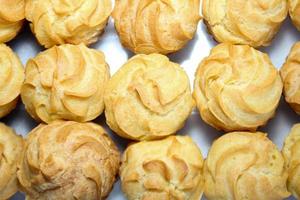 Creamy eclairs in Indonesia called kue sus filled with cream puffs photo