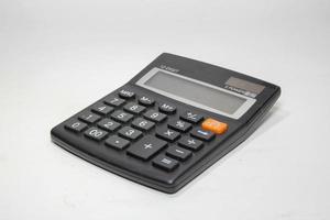 Black digital calculator isolated on the top view white background photo