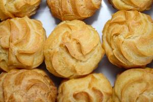 Creamy eclairs in Indonesia called kue sus filled with cream puffs photo