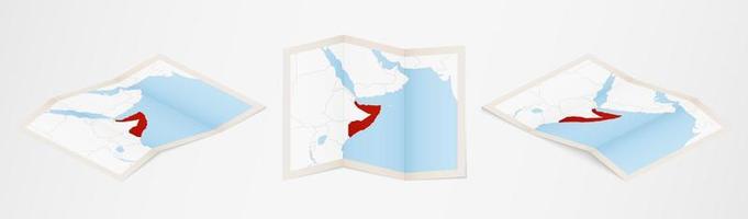 Folded map of Somalia in three different versions. vector