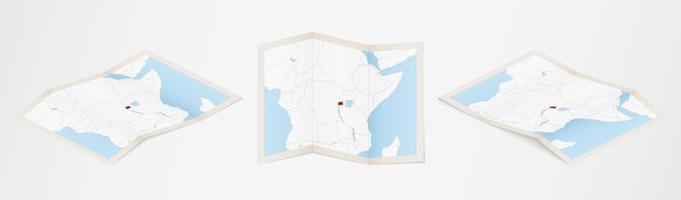 Folded map of Rwanda in three different versions. vector