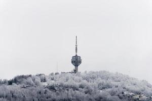 Winter view of destroyed Sarajevo TV Tower. The Hum Tower or Toranj Hum is a telecommunication tower located on Mount Hum in the periphery of Sarajevo. Symbol of a city. photo