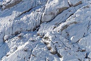 Amazing view of the mountain full of snow in the winter during a sunny day. Beautiful mountain range and amazing attraction for alpine climbers. Adventurous lifestyle. photo