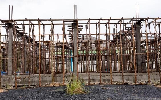 Close-up background view of scaffolding eucalyptus logs which are assembled together. photo