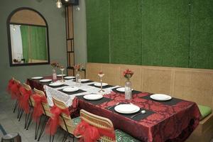 Table and Chairs in Decoration Arrangement Room for a Traditional Wedding Ceremony in Indonesia photo